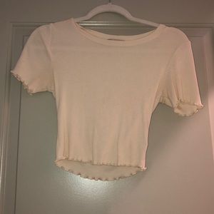 cream lettuce hem shirt
